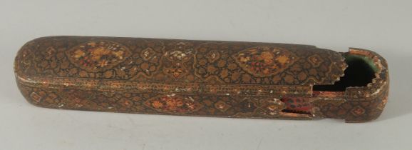 A FINE MID-19TH CENTURY INDO PERSIAN KASHMIRI LACQUERED PAPIER-MACHE QALAMDAN PEN BOX, 25cm long.