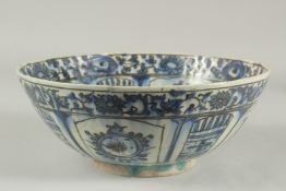 A 17TH-18TH CENTURY PERSIAN SAFAVID GLAZED POTTERY BLUE AND WHITE BOWL, with signature at the