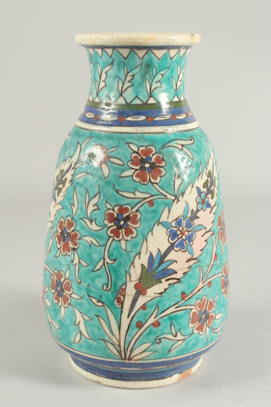 A LARGE EARLY 20TH CENTURY PALISTINIAN JERUSALEM GLAZED POTTERY VASE, 29cm high (af).