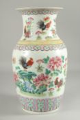 A CHINESE FAMILLE ROSE PORCELAIN VASE, painted with chickens and flora, 35.5cm high.