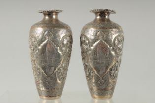 A PAIR OF EARLY 20TH CENTURY SIGNED PERSIAN SILVER VASES, with fine engraved decoration, each