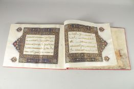 A FINE 20TH CENTURY KUFIC STYLE QURAN SECTION, with leather overlaid binding, the pages made of