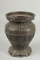 A JAPANESE BRONZE BASKET FORM VASE, 19.5cm high.