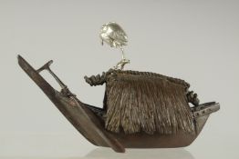 A JAPANESE BRONZE MODEL OF A BOAT WITH SILVERED CRANE ATOP, 11.5cm long.