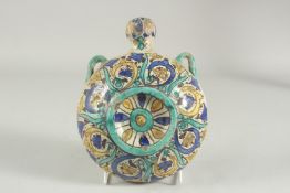 A 19TH CENTURY MOROCCAN GLAZED POTTERY WATER MOON FLASK, 21cm high.
