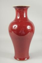 A CHINESE SANG DE BOEUF PORCELAIN VASE, with character mark to base, 36cm high.