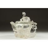 A CHINESE ROCK CRYSTAL TEAPOT, with relief birds and foliate formations, 11.5cm high.