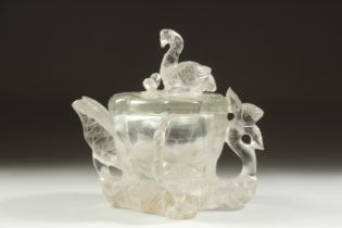 A CHINESE ROCK CRYSTAL TEAPOT, with relief birds and foliate formations, 11.5cm high.