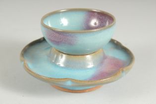 A CHINESE JUN WARE STYLE CUP AND SAUCER, cup 7.5cm and saucer 12.cm.