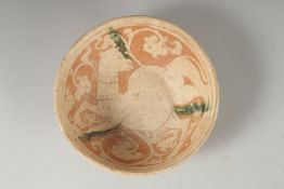 A FINE RARE PERSIAN GARUS POTTERY BOWL - POSSIBLY 12TH-13TH CENTURY, with a camel design, 18cm