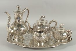 A FINE CHINESE EXPORT SILVER TEA SET AND TRAY, comprising teapot, water pot, milk jug, sugar bowl,