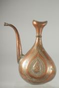A 17TH-18TH CENTURY PERSIAN SAFAVID ENGRAVED COPPER EWER, 31cm high.