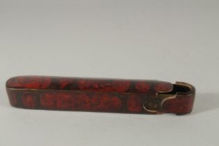 A FINE 19TH CENTURY PERSIAN QAJAR LACQUERED PAPIER-MACHE QALAMDAN PEN BOX, 22.5cm long.