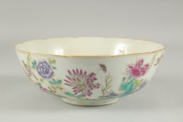 A CHINESE FAMILLE ROSE PORCELAIN BOWL, painted with flora, 22.5cm diameter.