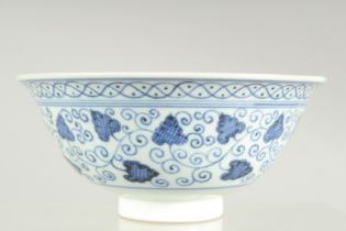 A FINE CHINESE BLUE AND WHITE PORCELAIN BOWL, with various decorative scrolling floral motifs, the