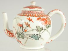 A FINE JAPANESE KUTANI PORCELAIN MINIATURE TEAPOT, painted with flora and embellished with gilt