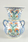 AN OTTOMAN TURKISH IZNIK GLAZED POTTERY MOSQUE LAMP, 31cm high.