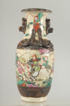 A SMALL CHINESE FAMILLE ROSE GLAZED POTTERY VASE, beautifully painted with figures on horseback, the