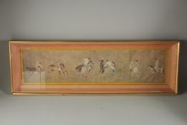 A FRAMED AND GLAZED CHINESE PRINT OF FIGURES ON HORSEBACK.