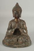A BRASS BUDDHA, with traces of gilding.