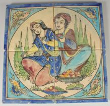 A SET OF FOUR GLAZED POTTERY TILES, together painted with a seated male and female with bird
