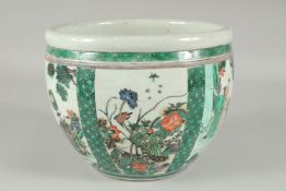 A CHINESE FAMILLE VERTE PORCELAIN JARDINIERE, decorated with panels of figures, flora and fauna,