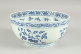 A CHINESE BLUE AND WHITE PORCELAIN BOWL, painted with various fruits and floral motifs, the base