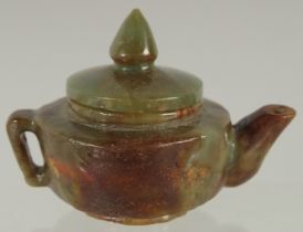 A CHINESE CARVED JADE MINIATURE TEAPOT, 9cm wide (spout to handle).