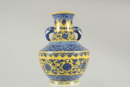 A CHINESE YELLOW GROUND BLUE AND WHITE PORCELAIN TWIN HANDLE VASE, six-character mark to base,
