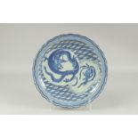 A LARGE CHINESE BLUE AND WHITE PORCELAIN DISH, painted with dragon and phoenix, the dish with