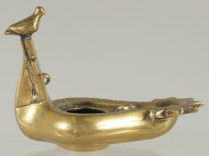 A ROMAN / GREEK STYLE BRASS OIL LAMP, 10.5cm long.