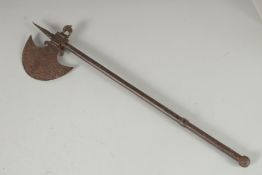 A 19TH CENTURY INDIAN SILVER INLAID STEEL AXE with a concealed blade within the handle, 56cm long.