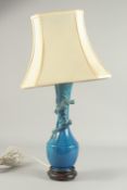 A CHINESE BLUE GLAZED PORCELAIN VASE LAMP, the neck with coiling dragon, vase mounted to a