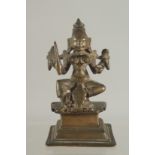 A SMALL INDIAN BRONZE DEITY, 11.5cm high.