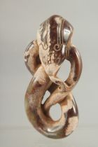 AN ARCHAIC CARVED JADE SNAKE PENDANT, 7cm.