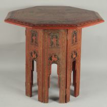 A BURMESE RED AND BLACK LACQUERED WOOD OCTAGONAL TABLE, with hinged folding legs, 65.5cm at widest