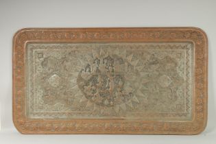 A VERY LARGE PERSIAN ISFAHAN EMBOSSED AND CHASED TINNED COPPER RECTANGULAR TRAY, with a central