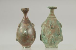 TWO 12TH-13TH CENTURY PERSIAN SELJUK BRONZE ROSEWATER BOTTLES, each 10.5cm high.