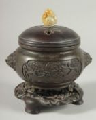 A CHINESE ARCHAIC STYLE BRONZE CENSER WITH CARVED JADE MOUNTED HARDWOOD COVER, on a fitted