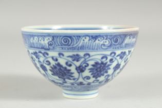 A SMALL CHINESE BLUE AND WHITE PORCELAIN BOWL, decorated with lotus motifs, character mark to