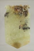 A CHINESE CARVED JADE AMULET, with archaic patterns and dragon, 9.5cm x 5.5cm.
