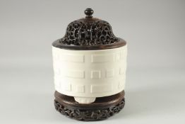 A CHINESE KANGXI BLANC-DE-CHINE PORCELAIN CENSER, with Taoist Eight Trigrams pattern, raised on