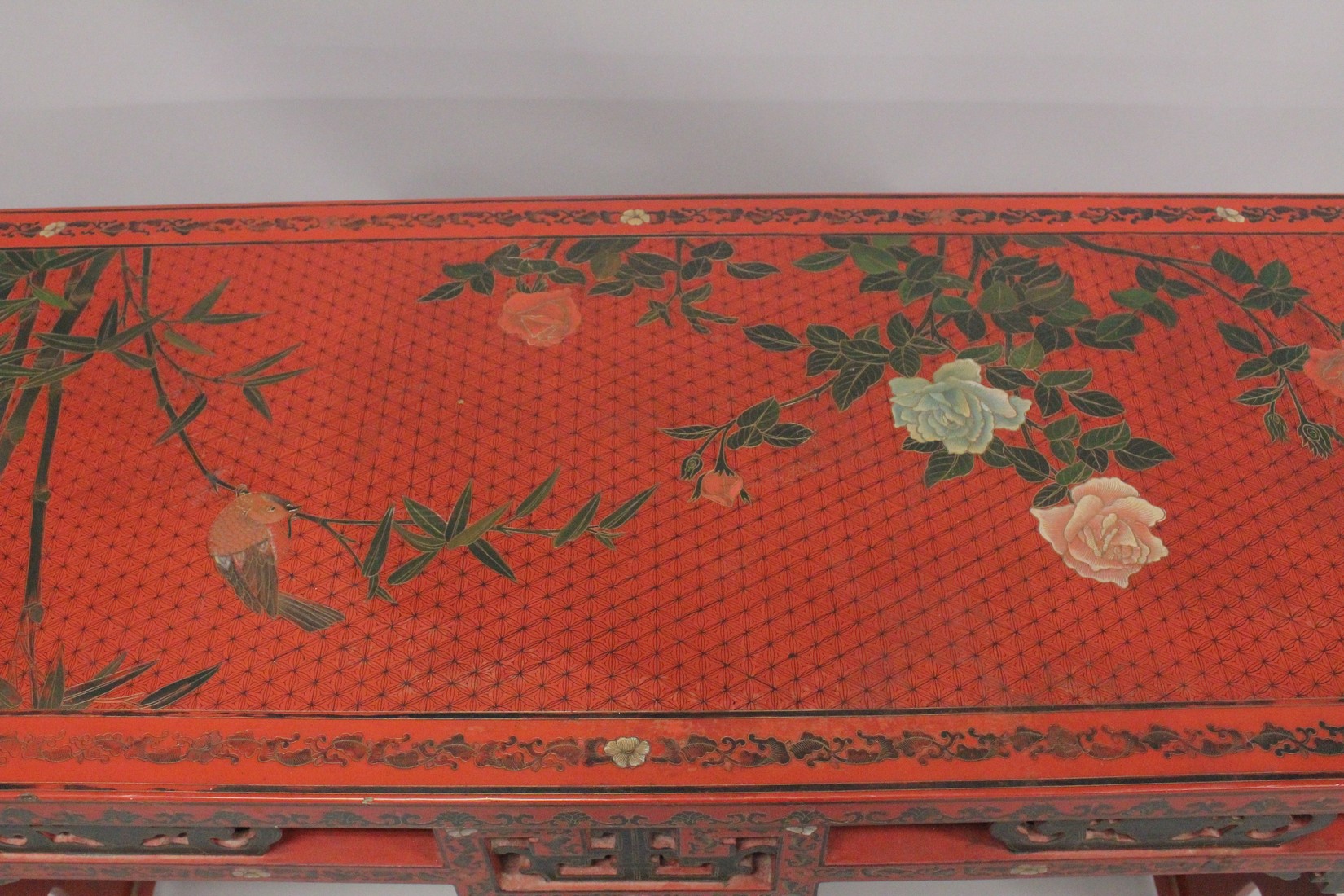 A CHINESE RED LACQUER AND CHINOISERIE DECORATED RECTANGULAR CONSOLE TABLE with a pierced frieze, - Image 5 of 7
