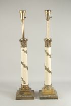 A PAIR OF CLASSICAL STYLE CREAM LACQUER AND ORMOLU COLUMN TABLE LAMPS. 2ft 9ins high overall.