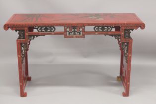 A CHINESE RED LACQUER AND CHINOISERIE DECORATED RECTANGULAR CONSOLE TABLE with a pierced frieze,