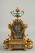 A VERY GOOD FRENCH ORMOLU AND SEVRES DESIGN CLOCK with urn finial, masks, acanthus and fruit, with