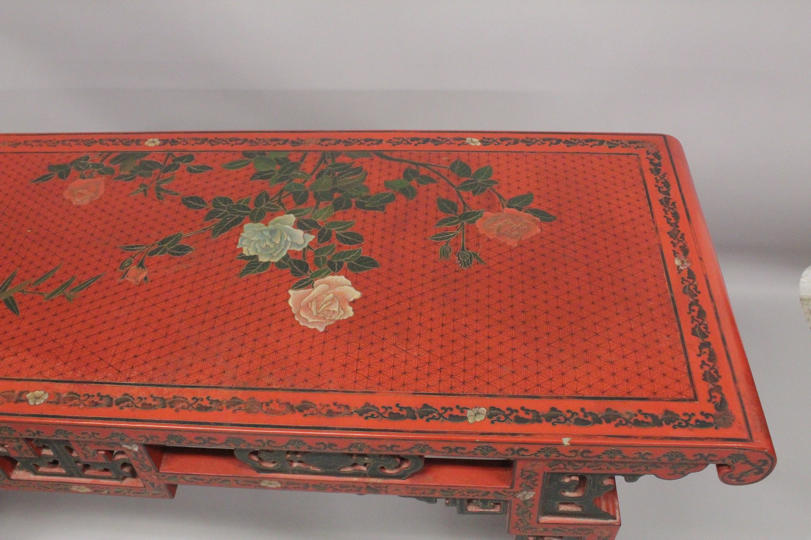 A CHINESE RED LACQUER AND CHINOISERIE DECORATED RECTANGULAR CONSOLE TABLE with a pierced frieze, - Image 6 of 7