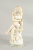 A GOOD CARVED MARBLE FIGURE OF A FAIRY on a circular base. 20ins high.