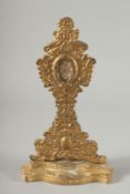 A RARE EARLY ITALIAN GILTWOOD RELIQUANT STAND with Papal seal verso. 11.5ins high.