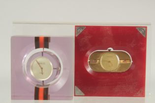 TWO GUCCI DESIGNER CLOCKS.